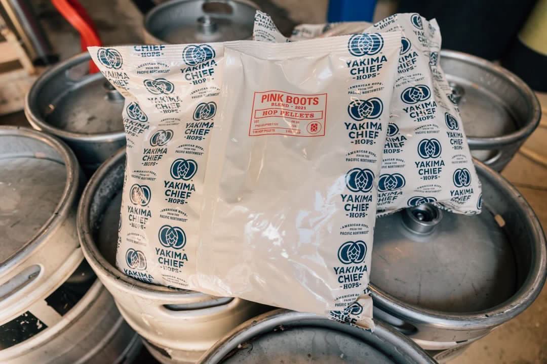 Pink Boots Blend bag sitting on top of kegs