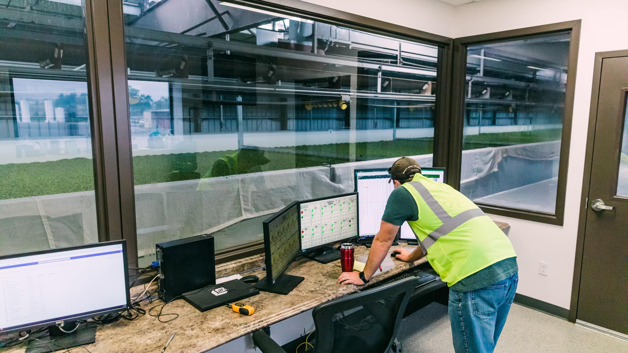 Image of man reviewing kiln temps on a computer monitor