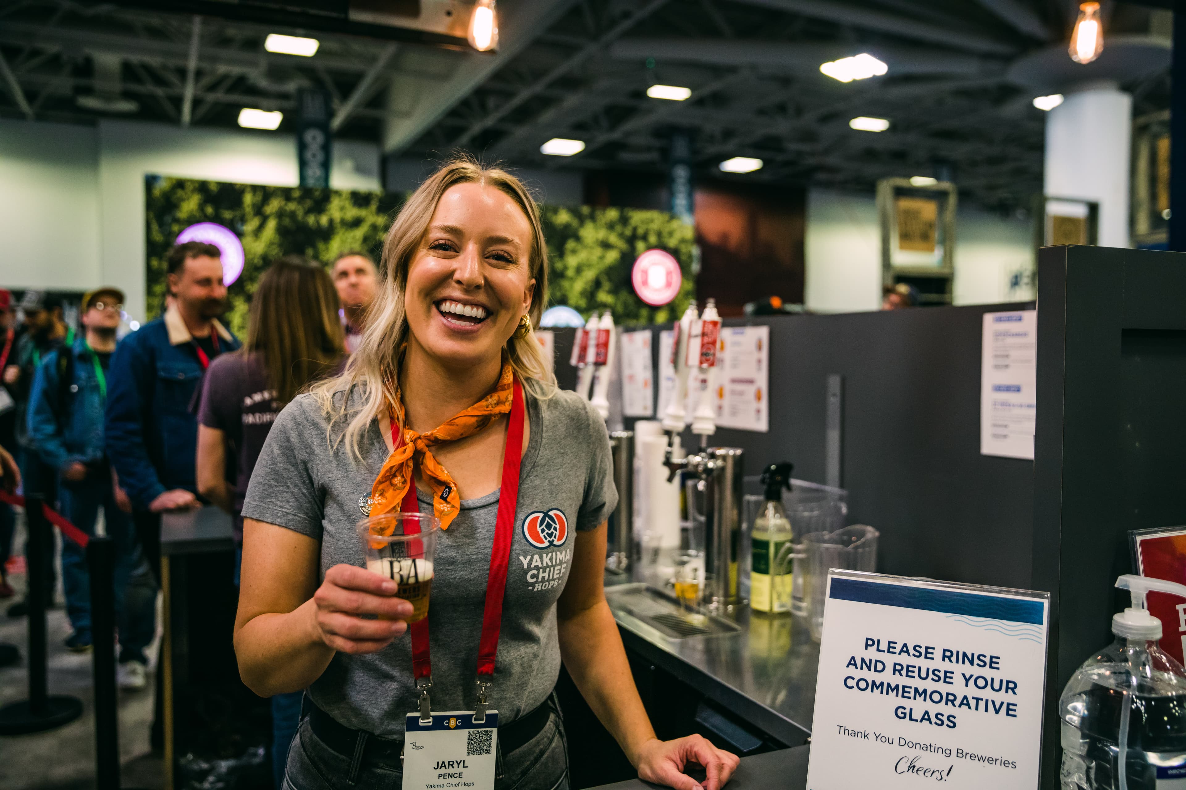 Smiling employee in Yakima Chief Hops t-shirt