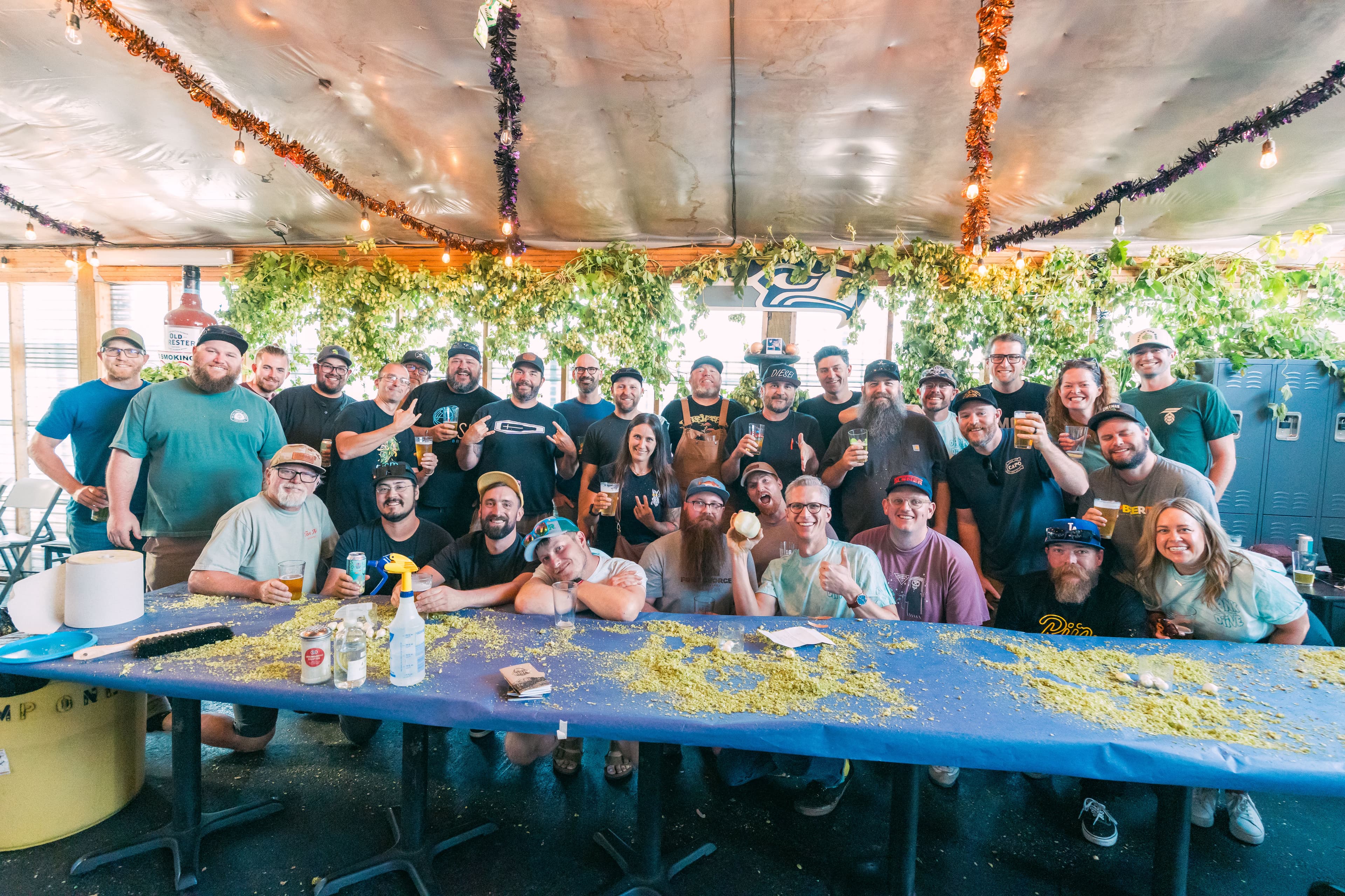 Large group of brewers smiling