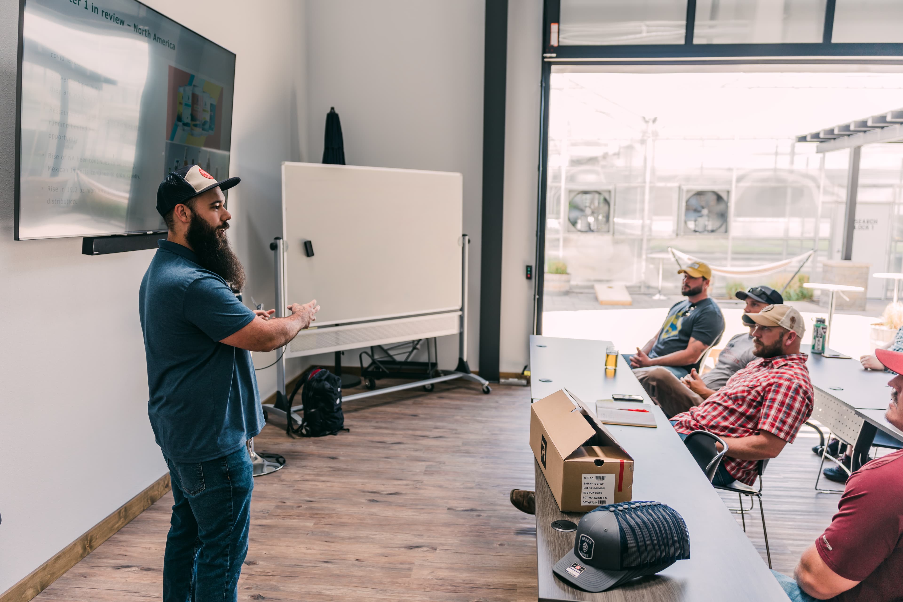 Executive team member presents to growers in classroom style setting