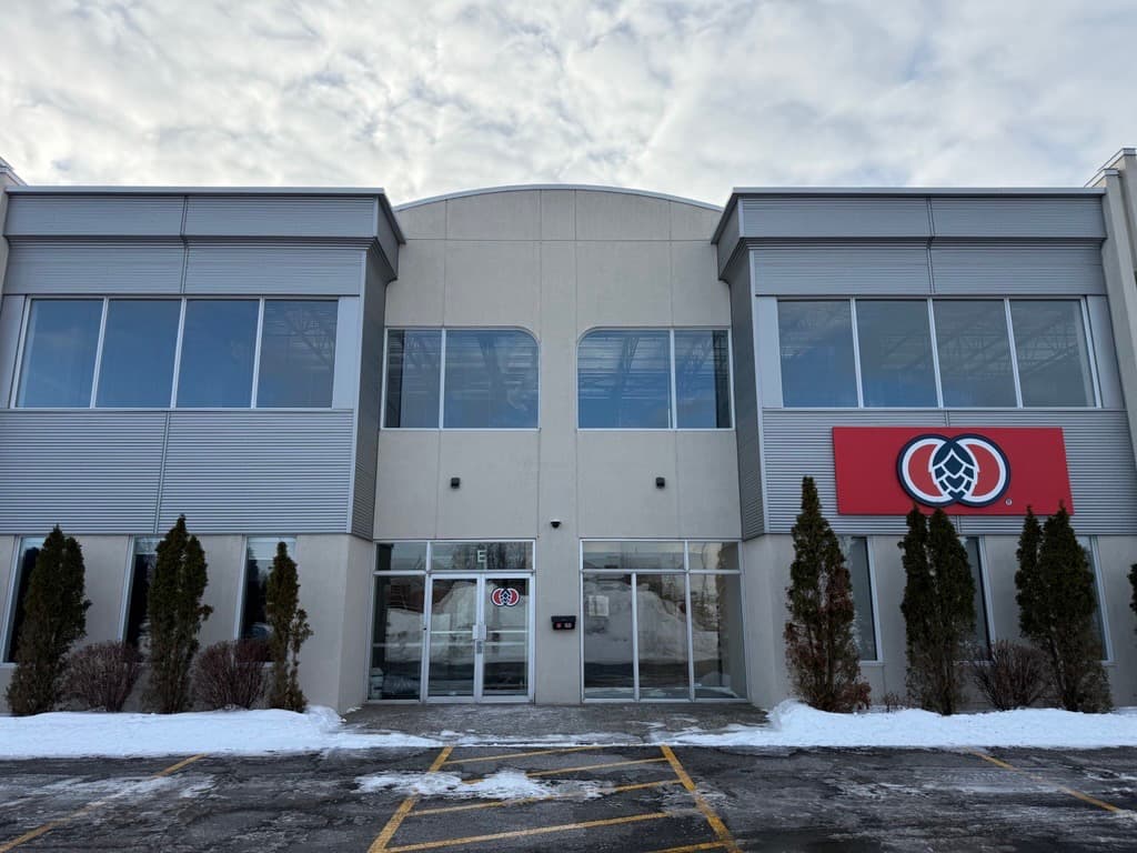 Street view of a business complex with Yakima Chief Hops sign