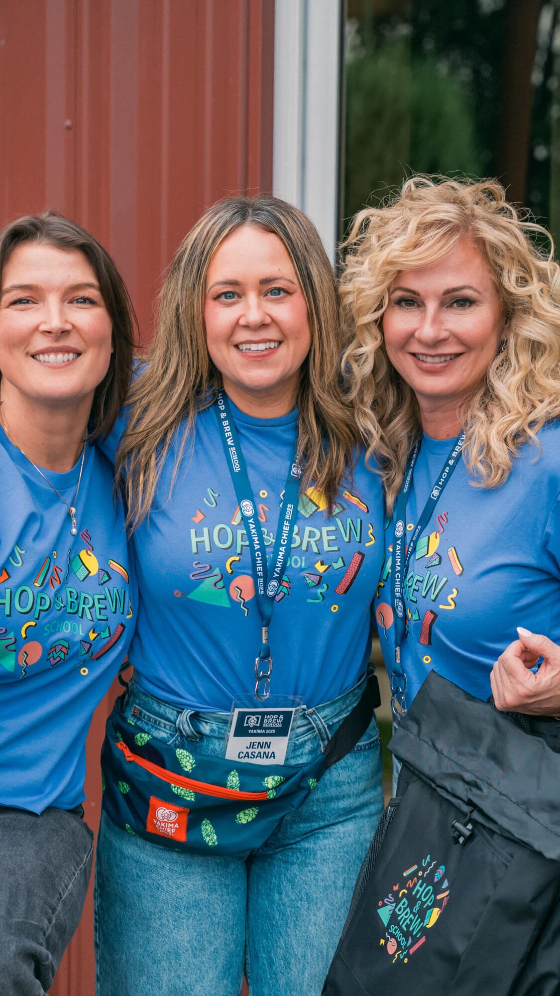 Group of employees smile for a photo at a Hop and Brew School event