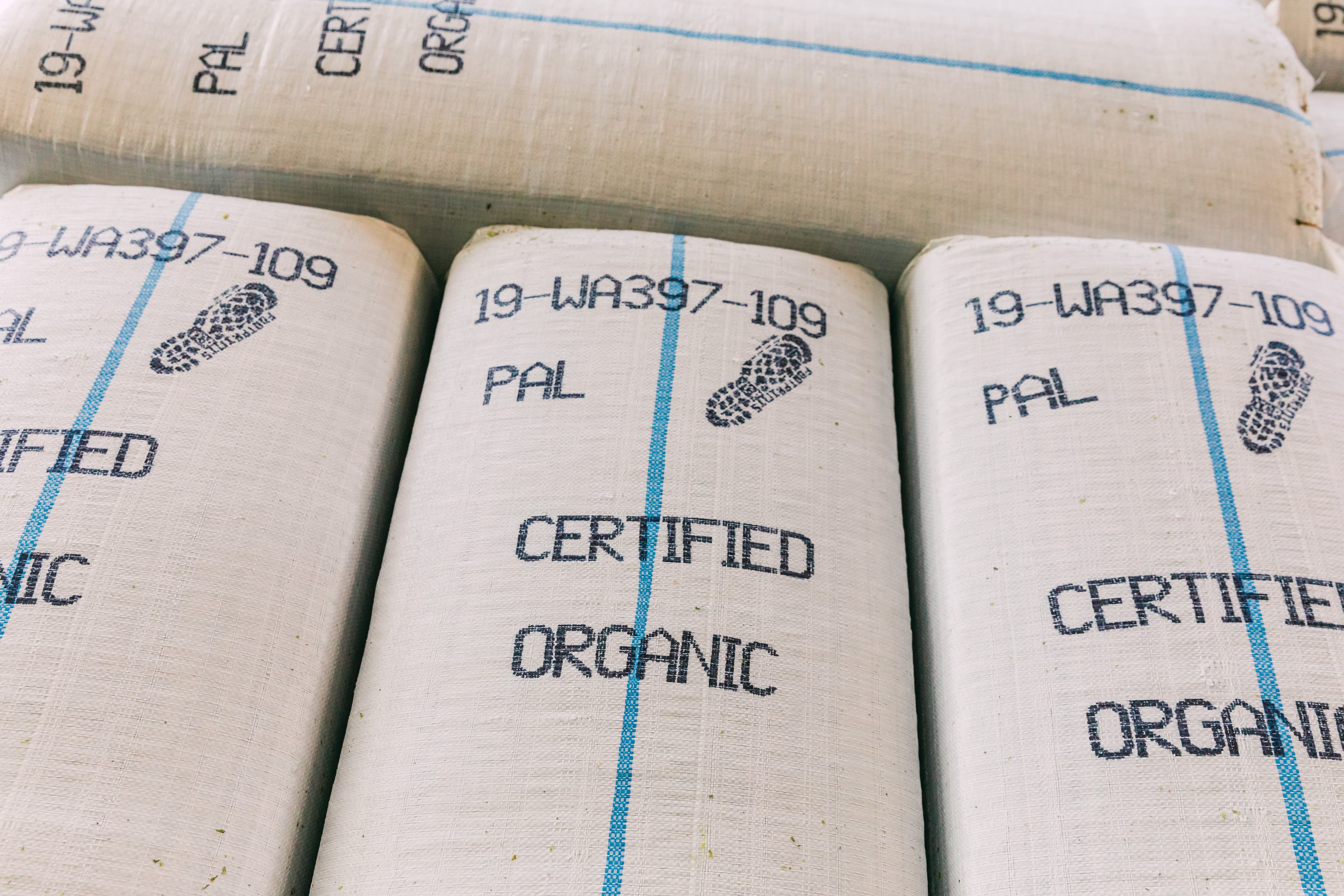 Hop bales with a Certified Organic stencil stamp